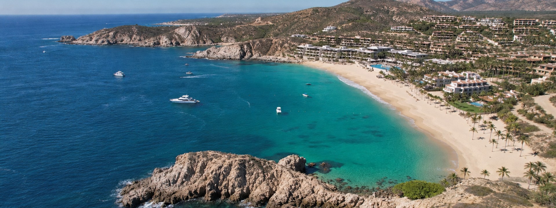 Luxury yacht fleet at Chileno Bay, Cabo San Lucas